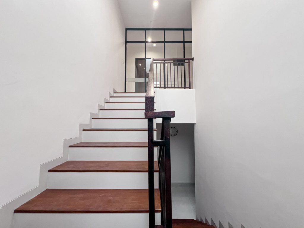 The staircase at Arcelon Premiere with timber treads and a steel balustrade