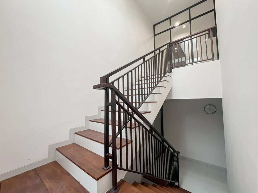 The staircase and landing at Arcelon Premiere with timber flooring