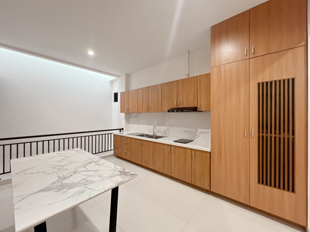 The communal kitchen and marble breakfast bar at Arcelon Premiere