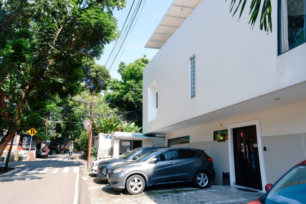 The street outside Arcelon Executive in Bendungan Hilir, with cars parked along the frontage