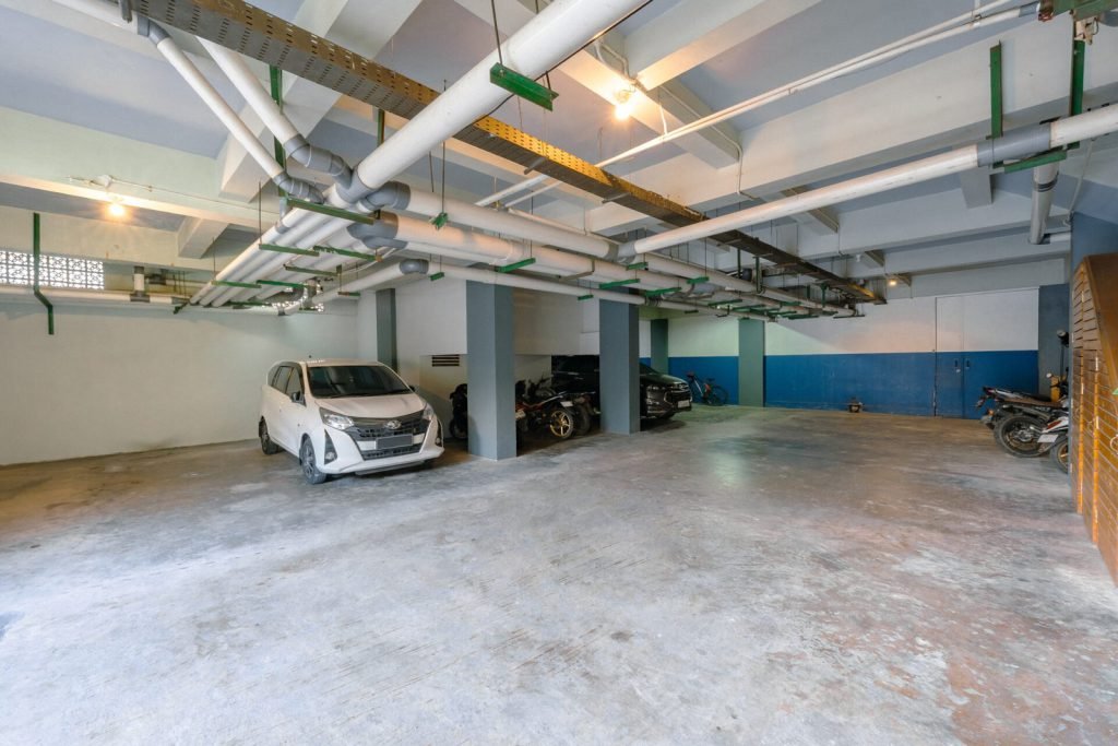 The basement parking level at Arcelon Stay Karawaci, looking along the bays
