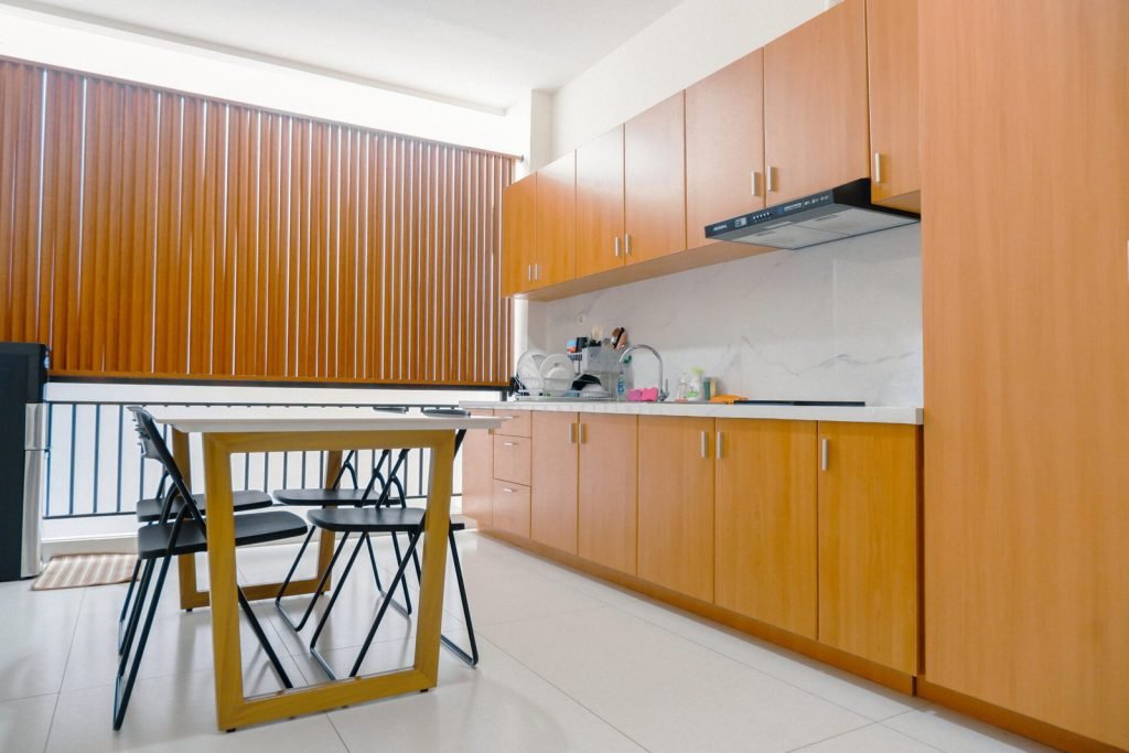 The communal pantry at Arcelon Premiere with a marble worktop and a dining table