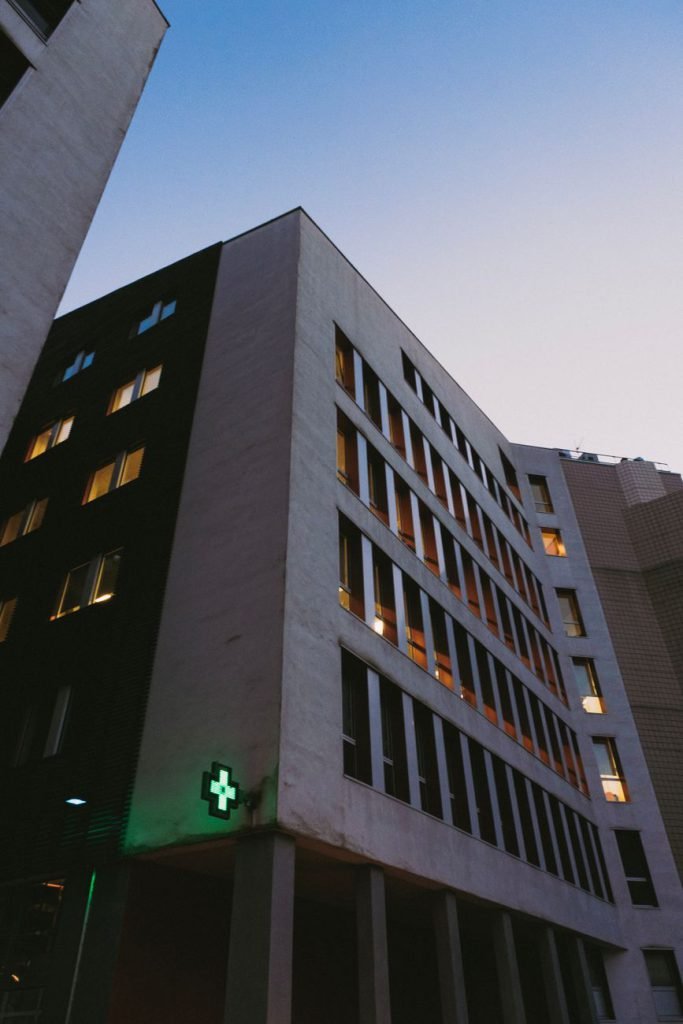 A modern hospital building seen from below