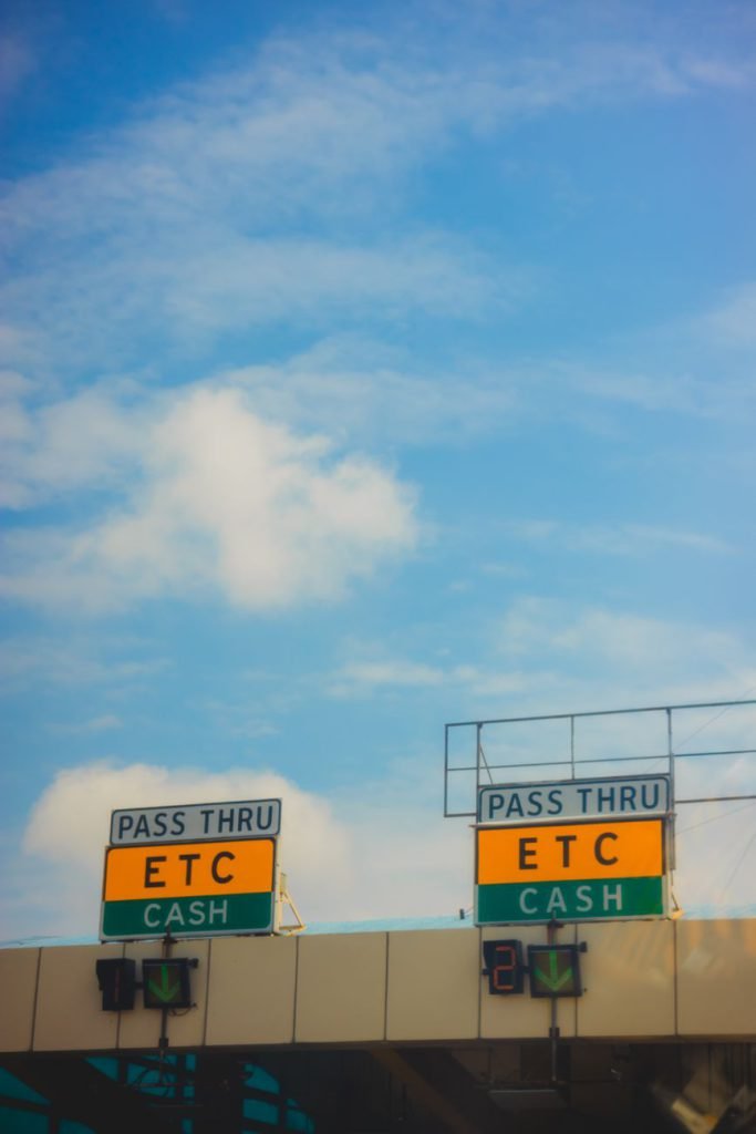 Automated toll booths on a road under a clear sky